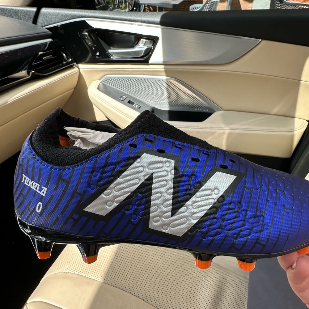 New Balance youth size 4 Blue and Black Soccer Cleats with Silver Logo